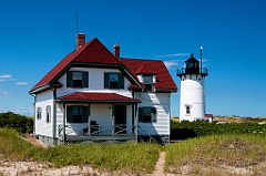 Race Point Light and Keepers Building on Cape Cod Beach